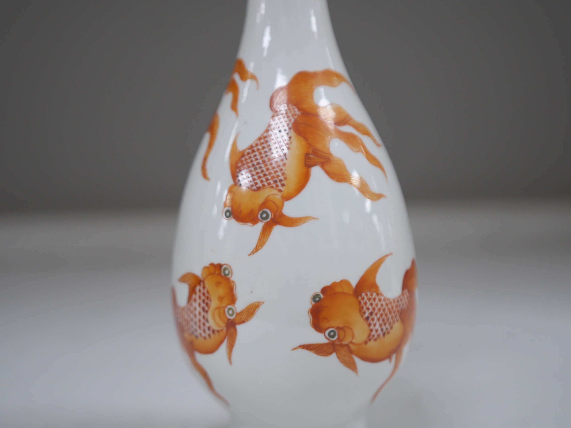 A Chinese iron red enamelled goldfish vase, 26cm high. Condition - good